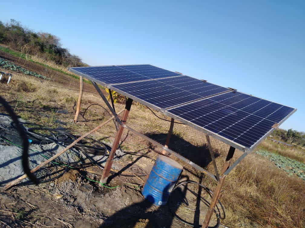 Field solar panel powering irrigation pump